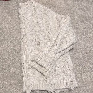 Small buckle sweater.